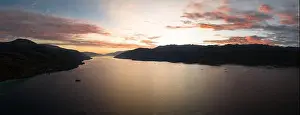A serene sunrise illuminates Kalabahi Bay surrounded by the island of Alor, Indonesia. This area inLesser Sunda Islands has high marine biodiversity