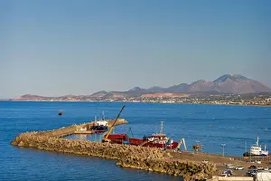 Greek Islands Prints: A serene view of the harbor in Crete