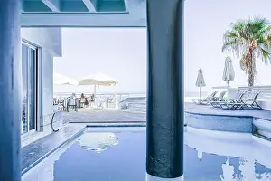 Parasols Prints: A serene view from a hotel in Rethymnon