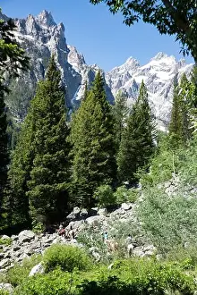 Unspoiled Prints: Serene view of riders on horseback exploring a rugged
