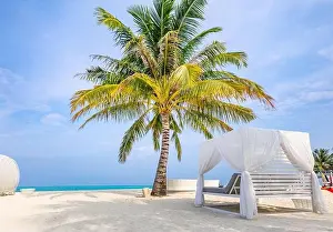 Serenity beach background, luxury beach canopy and travel or summer vacation concept. Blue sky with white sand for sunny beach landscape background