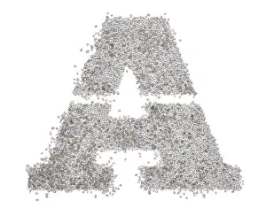 Serif sand letter capital A with sharp edges photographed on a white background