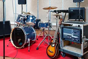 Set of stylish modern musical instruments ready for rehearsal of music band in modern sound studio