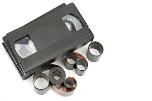 Reel Prints: A set of video tapes and photographic film isolated on white background