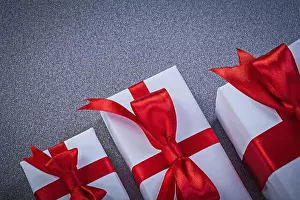 Knot Prints: Set of wrapped gift boxes on grey surface holidays concept