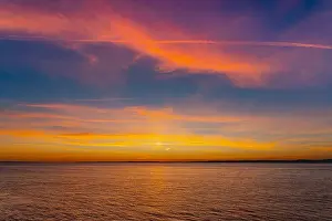 Sky Landscape Prints: The setting sun lighting up the cloud cover over the Severn Estuary