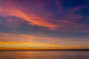 Sky Landscape Prints: The setting sun lighting up the cloud cover over the Severn Estuary