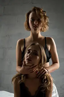 Submissive Prints: Two sexy girls in lingerie against brick wall