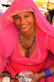 Sari Prints: A sexy Indian woman sells bangles in the Jodhpur market Rajasthan India