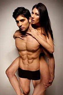 Intimacy Prints: Sexy Woman Riding Piggyback on the back of a handsome young man in underwear during foreplay