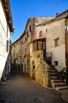 City Street Prints: Sezze, Italy, 05/10 / 2021. A street between old medieval stone buildings of a historic town in Lazio region