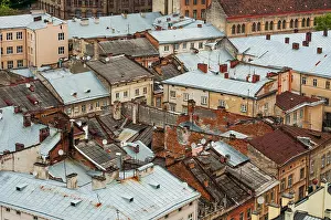 Tops Prints: Many shabby roofs of old city from the top in rainy day