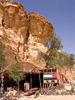 Escarpment Prints: shaded store outside petra jordan in lee of rock escarpment