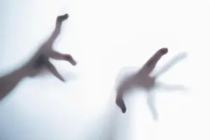 Panic Prints: Shadow of blurred creepy fingers from an unknown creature like an alien