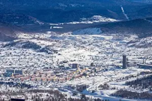 Sheregesh Prints: Sheregesh Kemerovo region ski resort in winter dawn sun on city