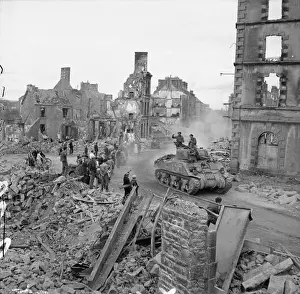 Armament Prints: Sherman tank of the British Army driving through the ruins of Flers