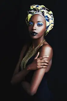 Professionalism Prints: Shes a true african beauty. A beautiful african woman posing against a black background