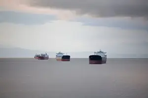 Ships anchored off the coast of Ferguson Point in Stanley Park Vancouver British Columbia Canada