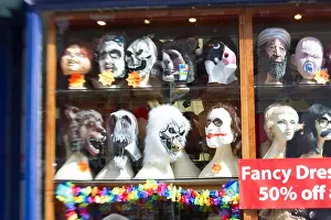 Masks Prints: Shop window full of wigs and masks
