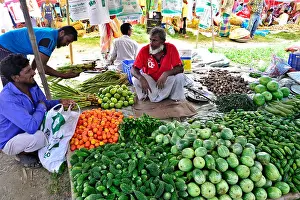 Villager Prints: A shopkeeper waiting for customers to sale vegetables at Kaikkarateke weekly market