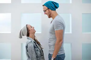 Face To Face Prints: Short woman and tall man laughing at each other