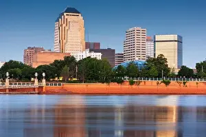 Shreveport, Louisiana, USA downtown skyline on the Red River at twilight