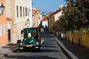 Praga Prints: Sightseeing tour bus on Uvoz street in Hradcany the castle district in Prague Czech Republic Europe