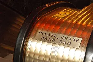 Rounded Prints: A sign on the escalators, in a vintage art deco style