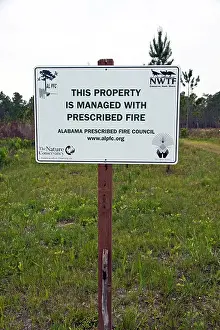Controlled Prints: Sign indicating the surrounding natural area is subject to prescribed burns as a tool of wildlife habitat management