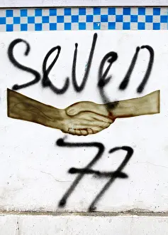Starkpix Prints: Sign of the notorious youth gang Seven-Seven on a police post in Dili, Timor Leste
