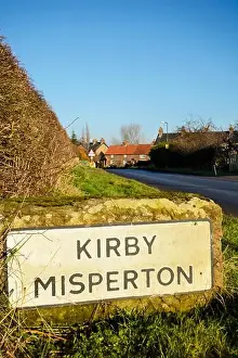 Fine Weather Prints: Name sign for the picturesque North Yorkshire village of Kirby Misperton