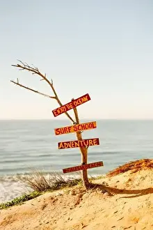 Sign of possibilities at Falesia beach with orange cliffs in Algarve, Portugal