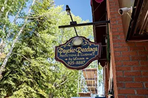 Brick Building Prints: A sign for psychic readings, predictions and guidance by Lauren in downtown Aspen