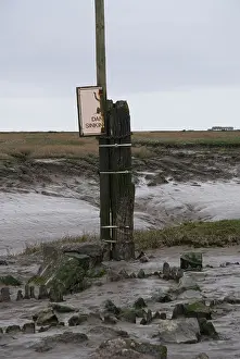 Somerset Prints: Sign warning of sinking mud on the beach at Weston Super Mare