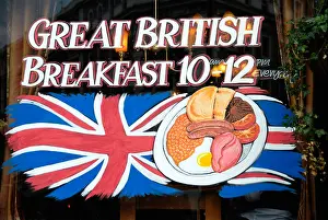 South East Prints: Sign in the window of a London pub advertising its offer of a Great British Breakfast between 10 and 12