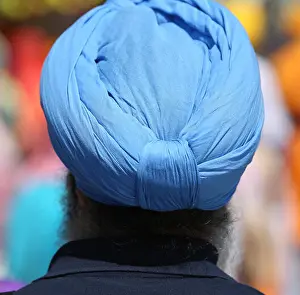 Headwear Prints: sikh man with blue turban during a religious ceremony
