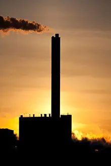 Release Prints: Silhouette of Stora-Enso paper mill at Nuottasaari Oulu Finland at dawn