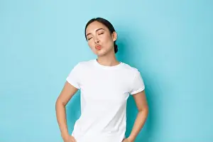 Light Blue Prints: Silly and cute asian girl close eyes and dreamy pouting