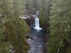 Silver Creek flows over the beautiful Upper North Falls near Silverton, Oregon. This scenic, heavily forested area harbors many impressive waterfalls