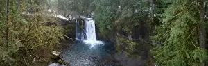 Silver Creek flows over the beautiful Upper North Falls near Silverton, Oregon. This scenic, heavily forested area harbors many impressive waterfalls