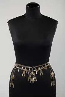 Toned Prints: A silver-toned metal necklace of Oriental inspiration