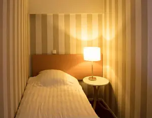 Switch Prints: Simple hotel room, single bed