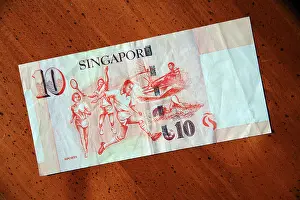 Capitalism Prints: Singapore 10 dollar currency note on table