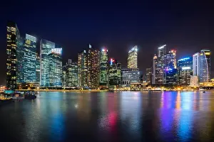 Singapore business district skyline financial downtown building with tourist sightseeing in night at Marina Bay, Singapore. Asian tourism, modern city