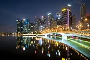 Singapore business district skyline financial downtown building with tourist sightseeing in night at Marina Bay, Singapore. Asian tourism, modern city