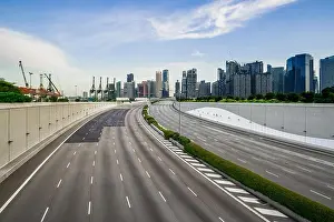 Landmark Tower Prints: Singapore business district skyline with tourist sightseeing with empty street at Marina Bay
