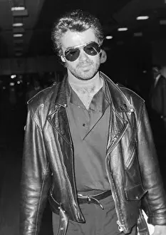 Relaxed Prints: Singer George Michael arriving at London's Heathrow Airport in 1989