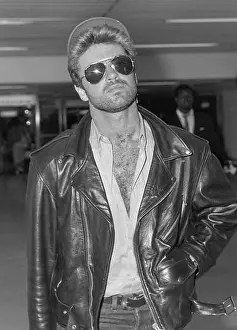 Relaxed Prints: Singer George Michael arriving at London's Heathrow Airport in july 1988