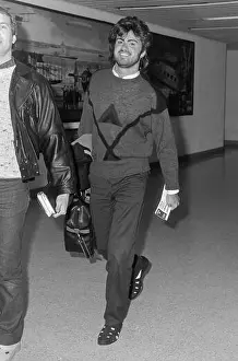 Relaxed Prints: Singer George Michael leaving London's Heathrow Airport in February 1986