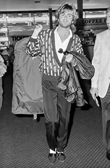 Relaxed Prints: Singer George Michael leaving London's Heathrow Airport in May 1985